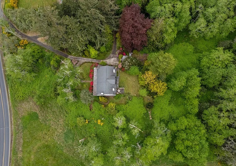 Aerial view of the estate set within 6.33 wooded acres in the Lewis & Clark Valley